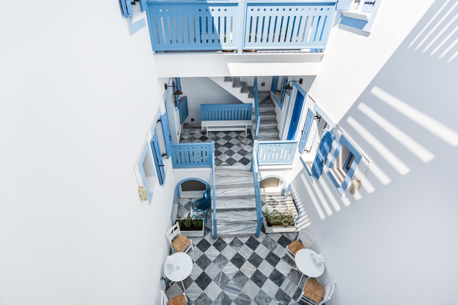 Marble staircase and blue railings in the courtyard
